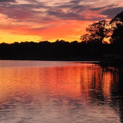Vibrant Magnificent Sunset Reflections Over Calm Lake Calm Water Dreamy Evening.jpg